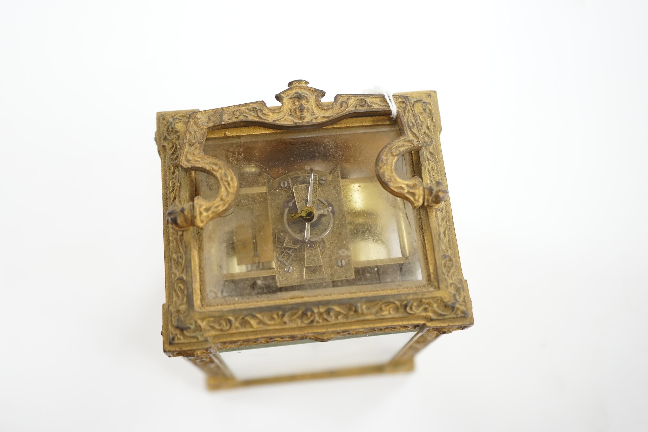A 19th century French fancy ormolu cased carriage clock, movement requires work, 13cm high. Condition - dial marked, gilding tarnished in places